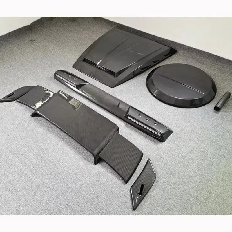 Suitable for 2019+ G-Class W463 W464 B-type Carbon Fiber 4-piece Set Engine Hood Roof Light Tire Cover Spoiler